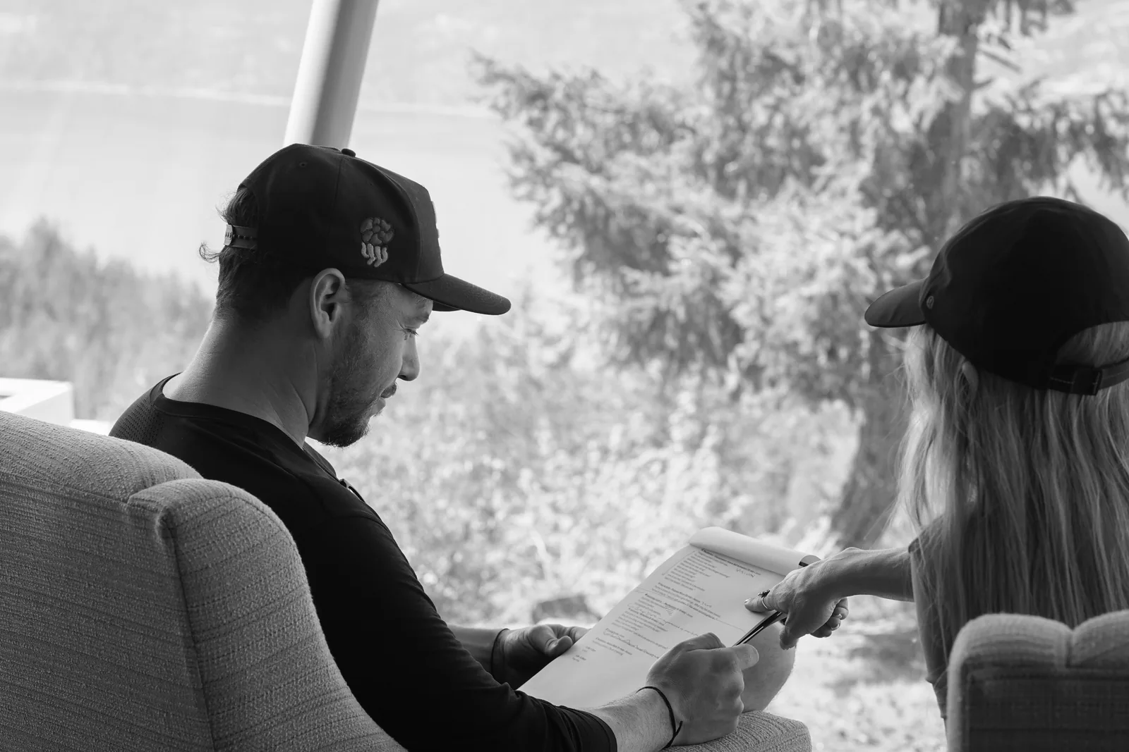 Jesse and Natalie looking through a workbook together