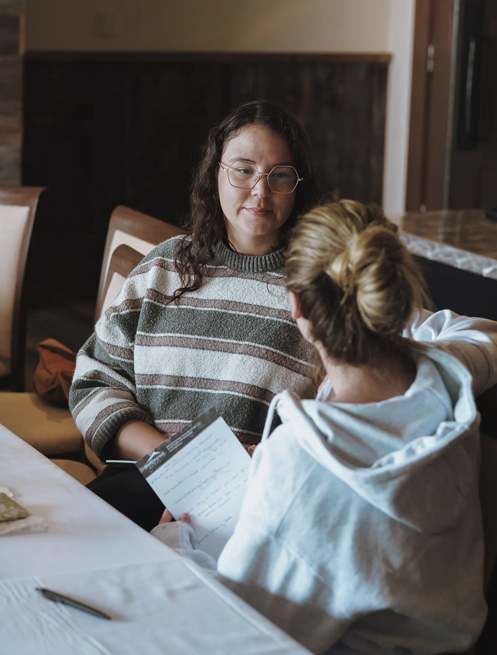 Guests sharing a conversation during a seated group session