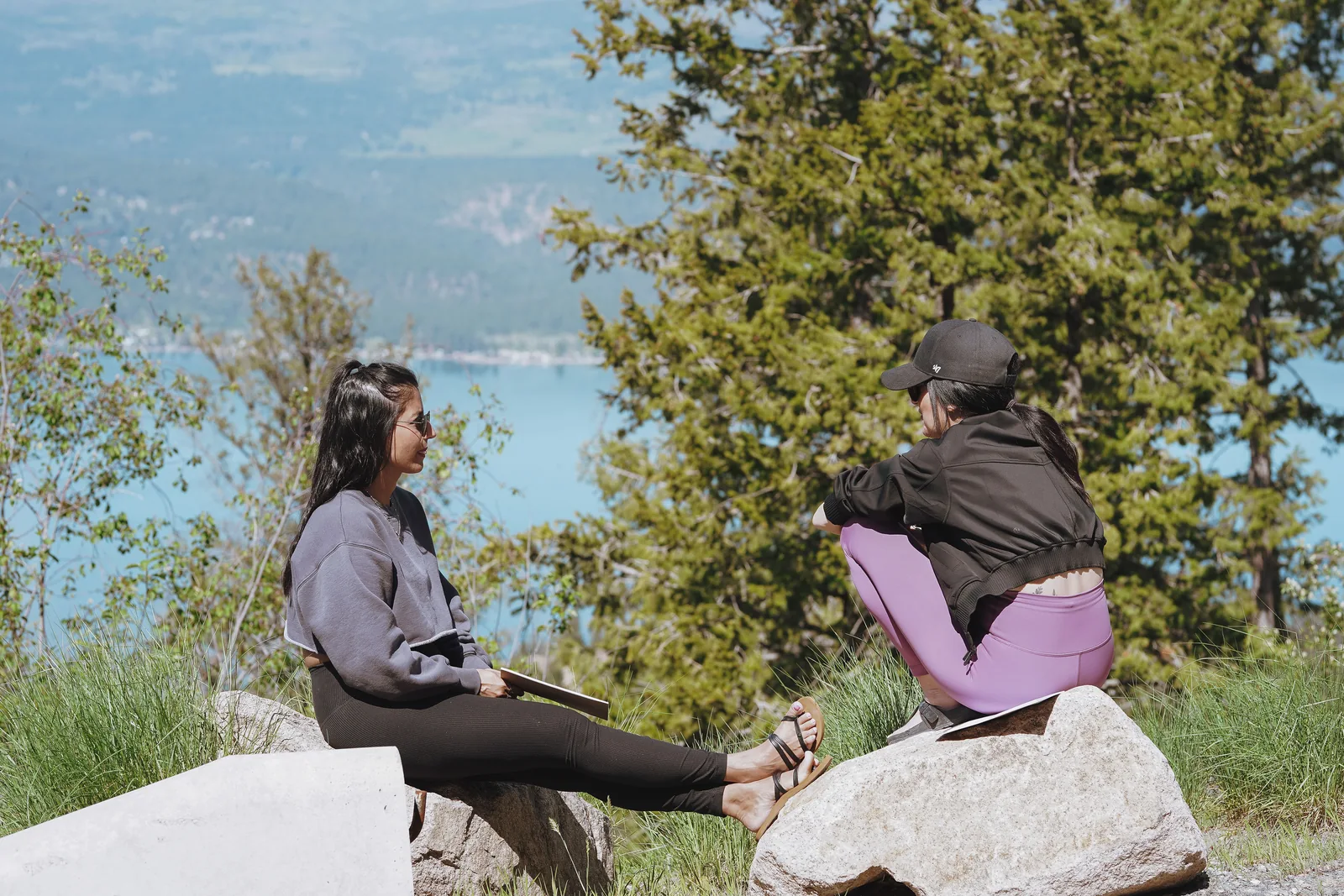 Guests sitting outdoors overlooking the lake during Spring Reset